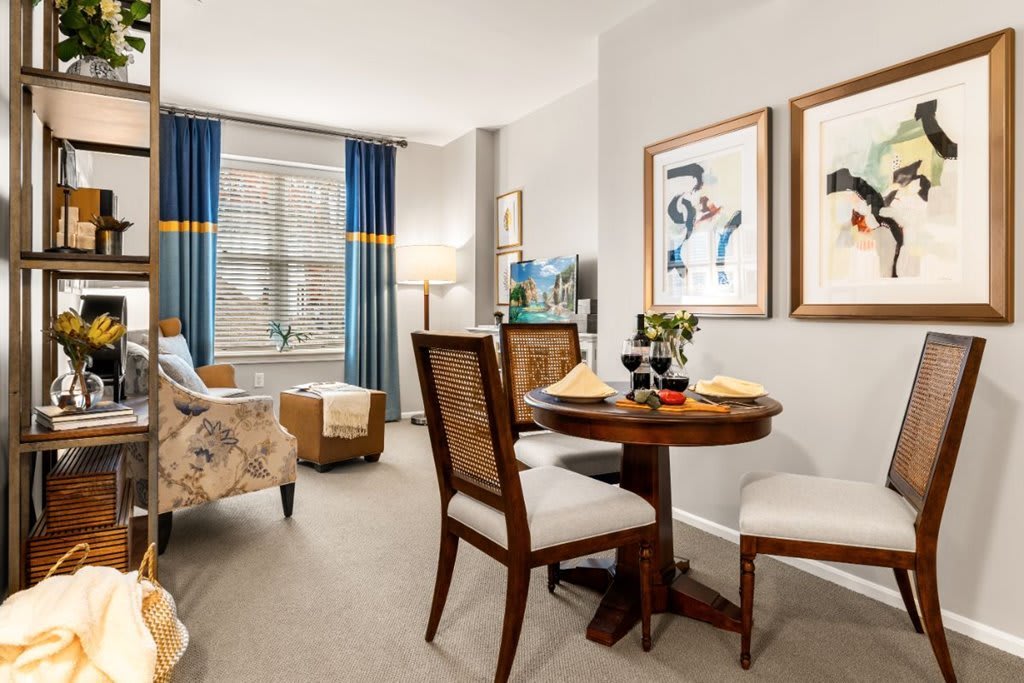A cozy living and dining area with elegant furniture and decor.