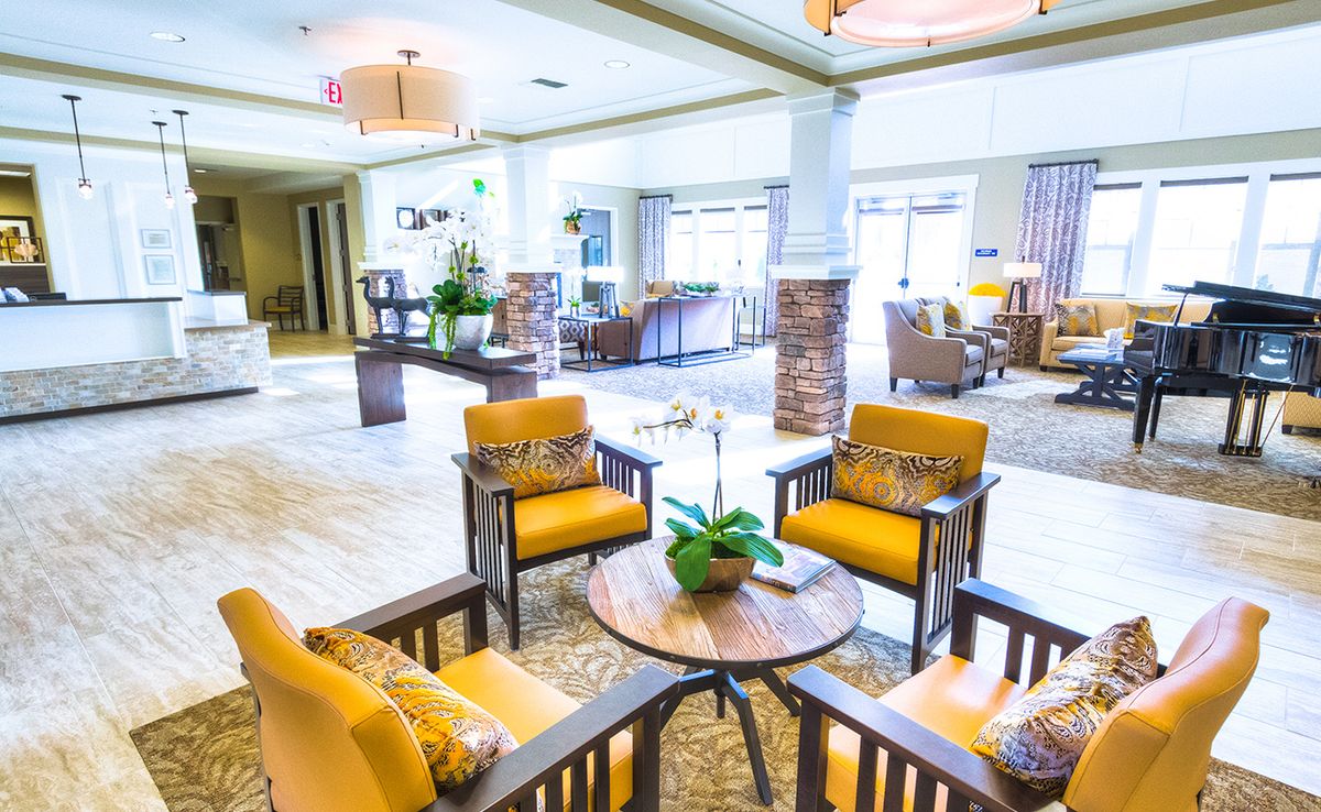 A modern and cozy lobby with bright seating arrangements.