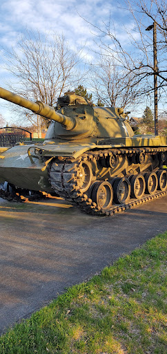 A military tank on display, showcasing its robust design and historical significance.
