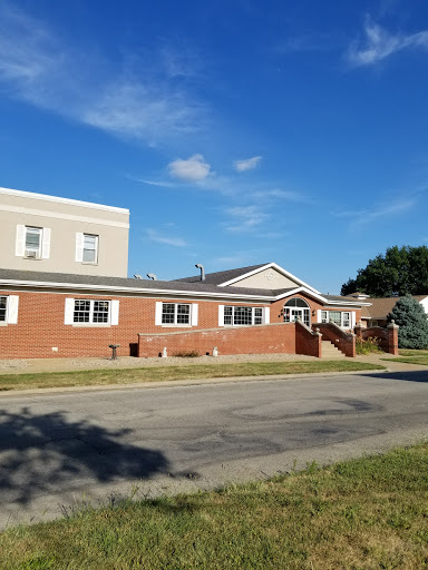 A view of a residential building under a clear blue sky.