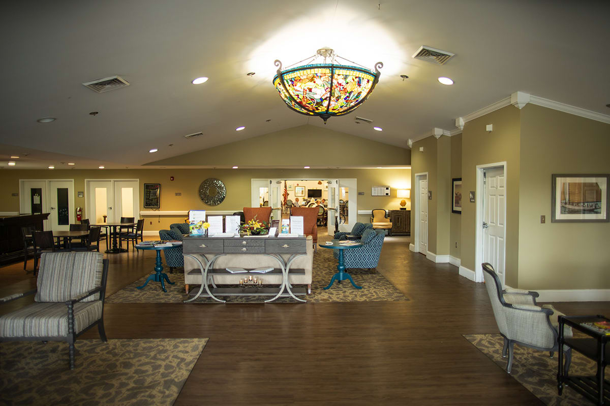 A spacious office lobby with comfortable seating and decorative lighting.