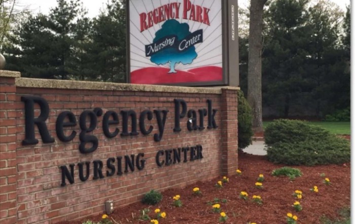 Sign for Regency Park Nursing Center with landscaped surroundings.