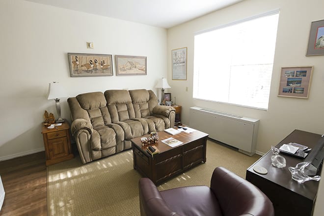 A cozy living room with comfortable seating and natural light.