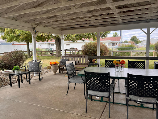 A cozy outdoor patio setting with comfortable seating, perfect for gatherings and enjoying nature.