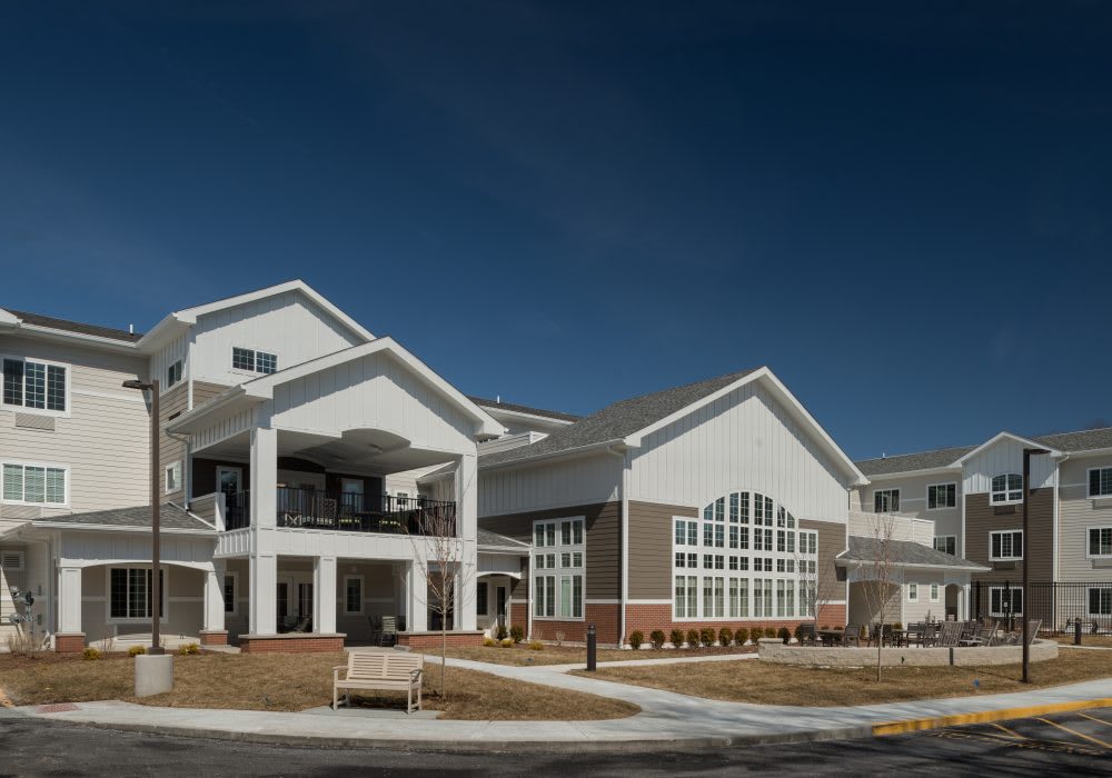 A modern residential building under a clear blue sky.