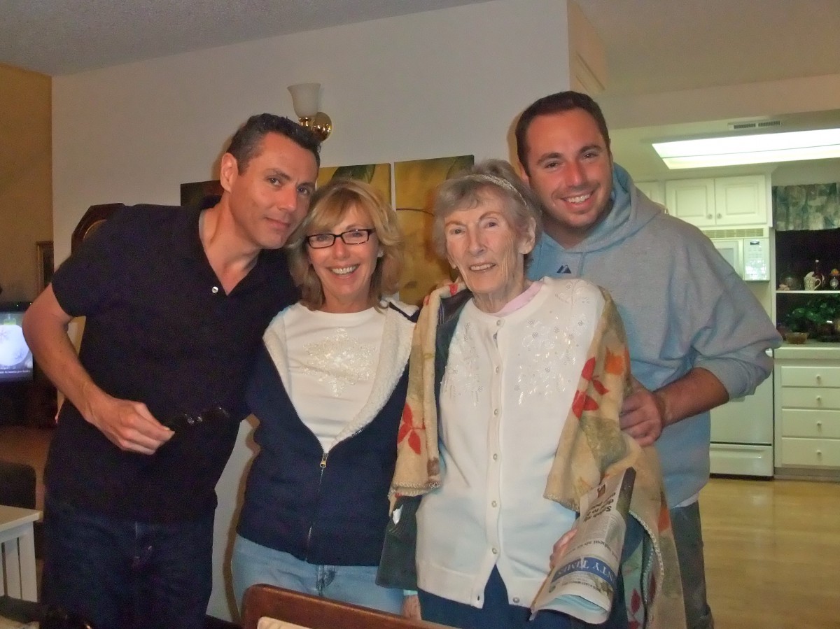 A group of people smiling and posing together indoors.