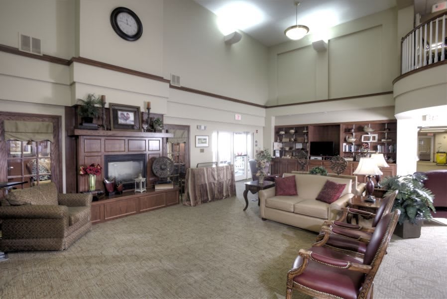 Spacious living room with classic decor and comfortable seating.