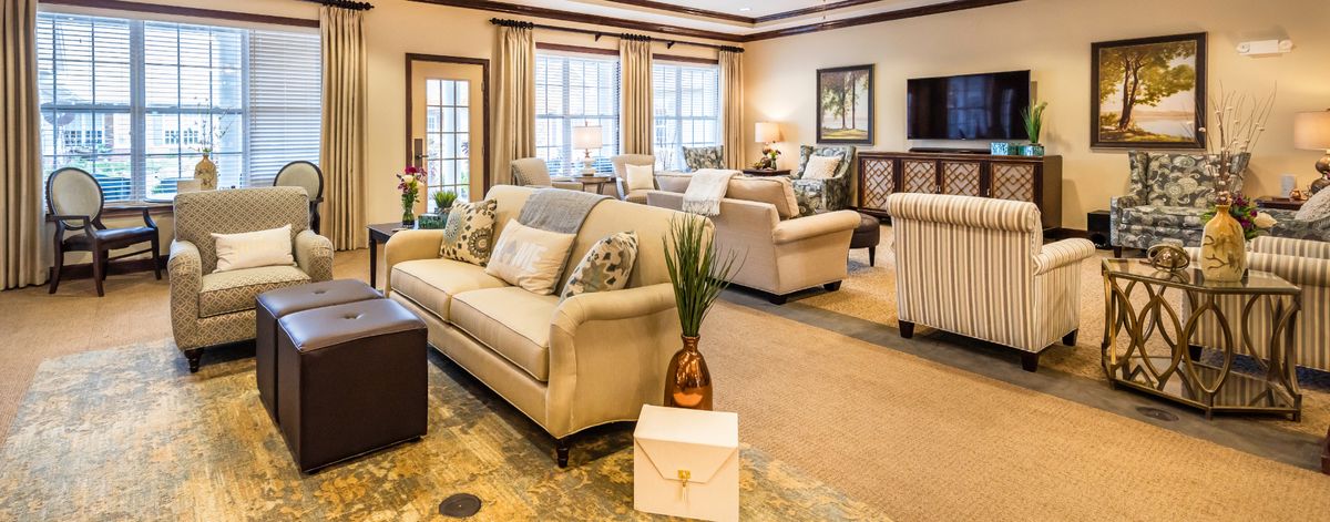 A cozy and well-decorated living room with elegant furnishings and soft lighting.