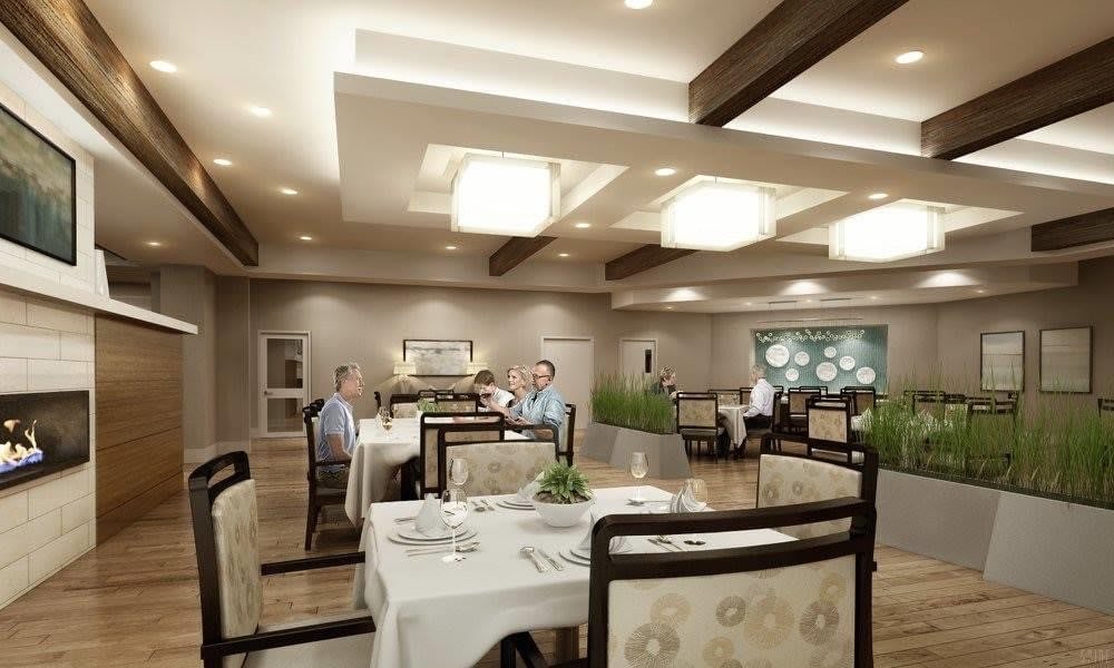 A modern and elegant restaurant interior with neatly arranged tables and ambient lighting.