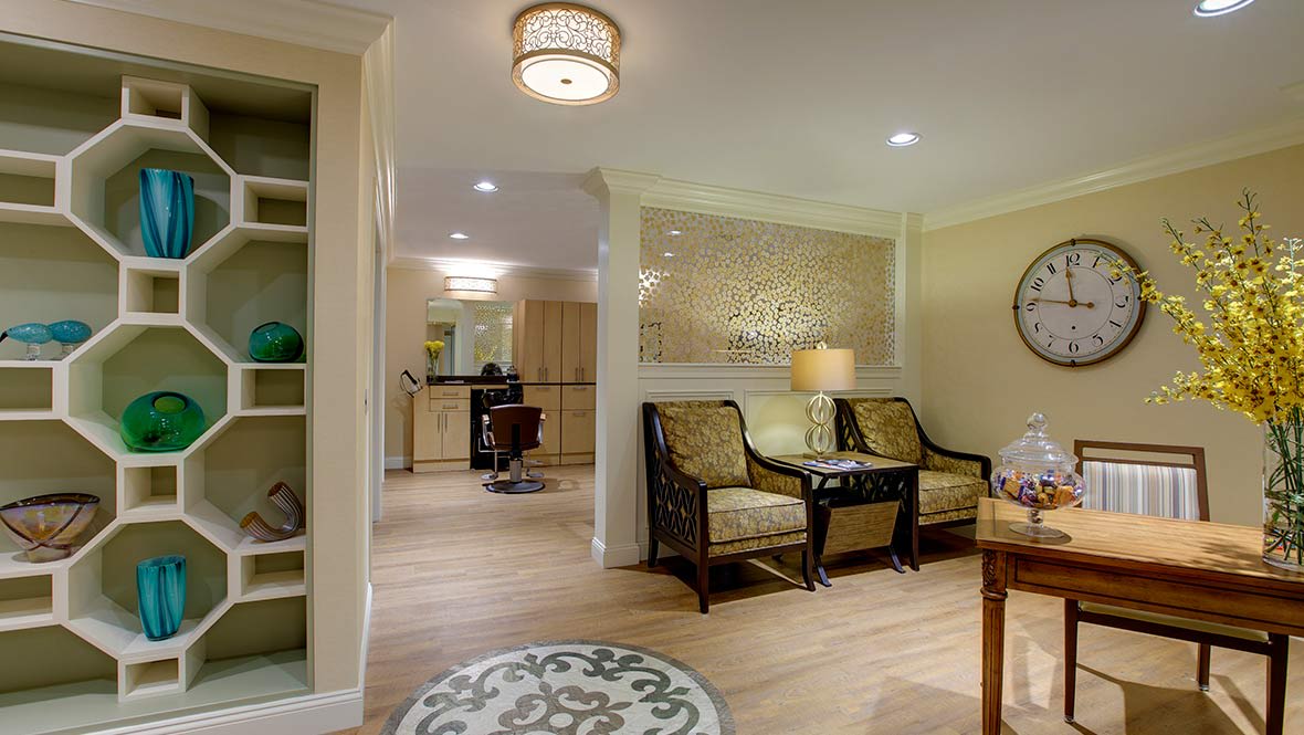 A cozy living room featuring elegant furniture and warm lighting.