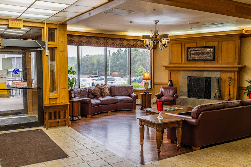 A warm and inviting lobby area featuring comfortable seating and natural light.