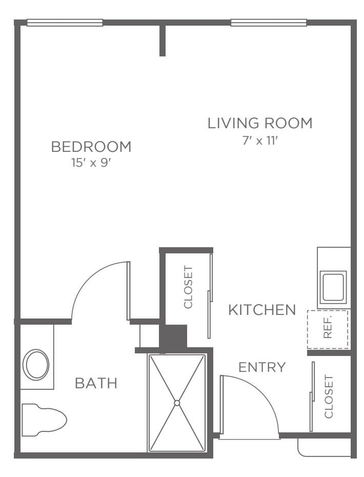 A floor plan of a one-bedroom apartment with labeled areas for the bedroom, living room, kitchen, and bath.