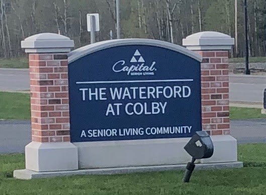 Sign for The Waterford at Colby, a senior living community.
