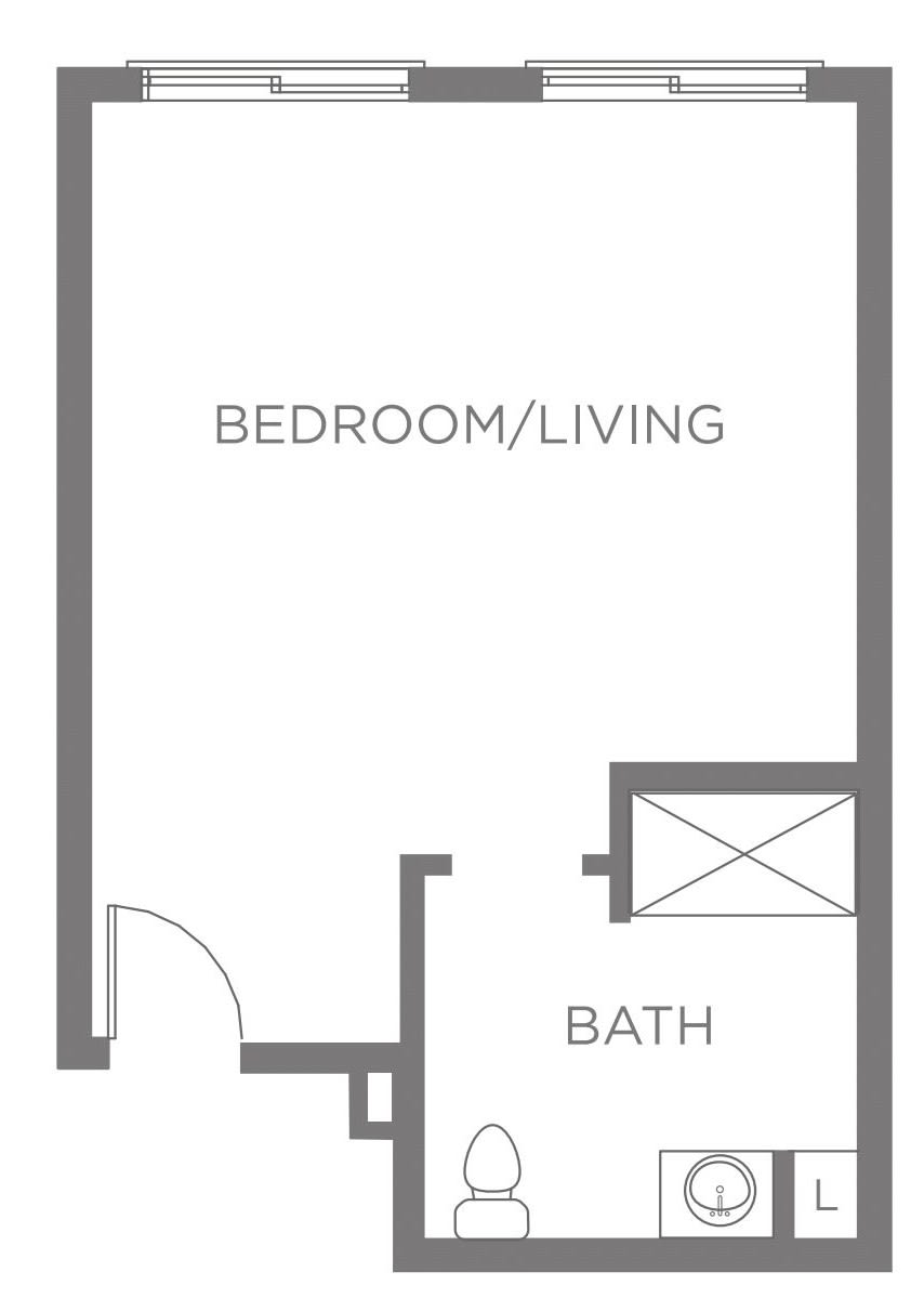 A simple floor plan of a studio apartment showing a combined bedroom/living area and a bathroom.