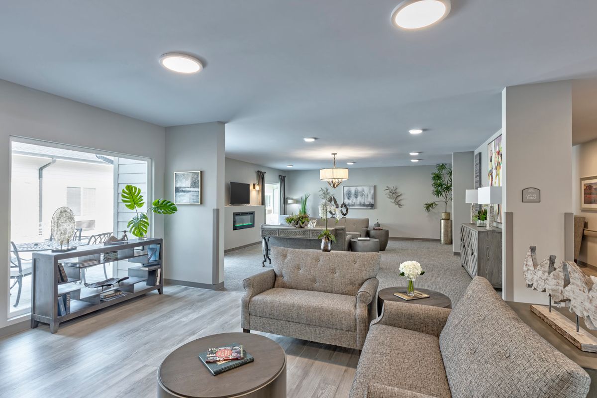 A spacious and modern living room with comfortable seating and elegant decor.
