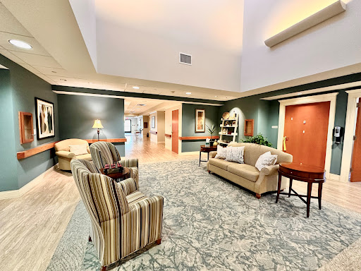 A cozy and inviting living room space with comfortable seating and soft lighting.
