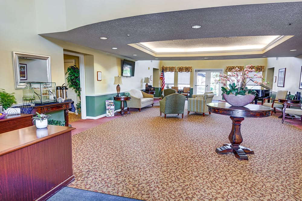A spacious lobby area with comfortable seating and decorative elements.