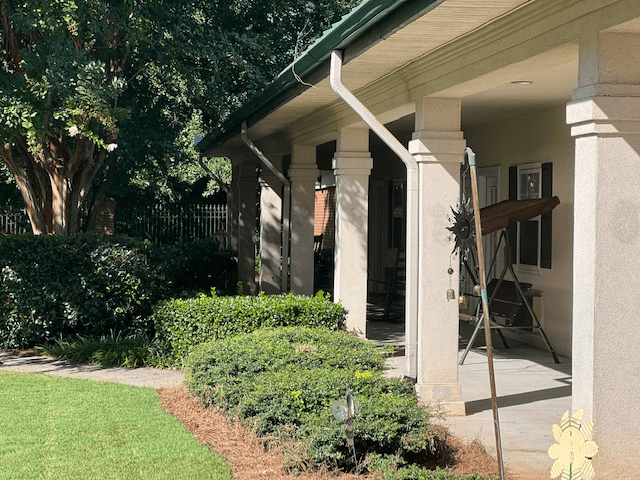A well-maintained house with a landscaped front yard and porch.