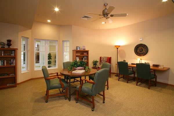 A cozy living room with comfortable seating and elegant decor.