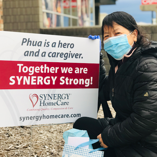 A dedicated caregiver celebrated as a hero, promoting unity and strength in the community.