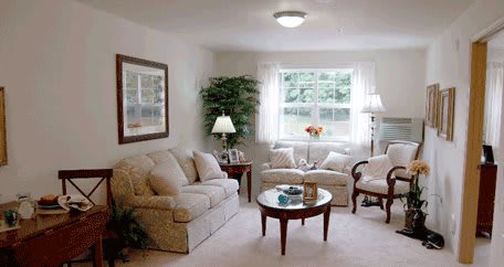 A cozy living room with comfortable seating and natural light.