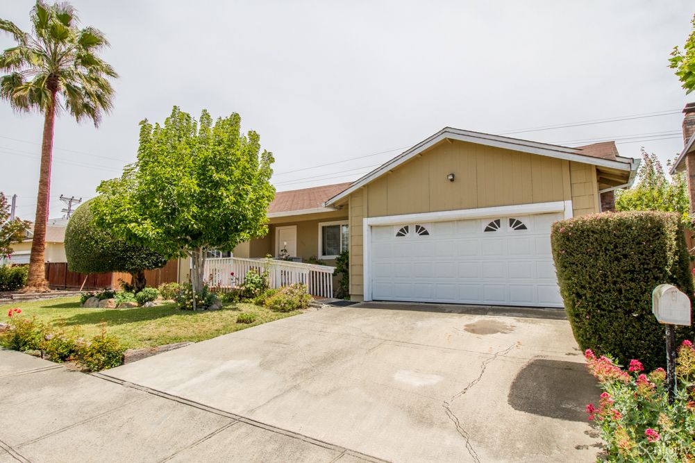 A suburban house with a two-car garage and a small front yard.