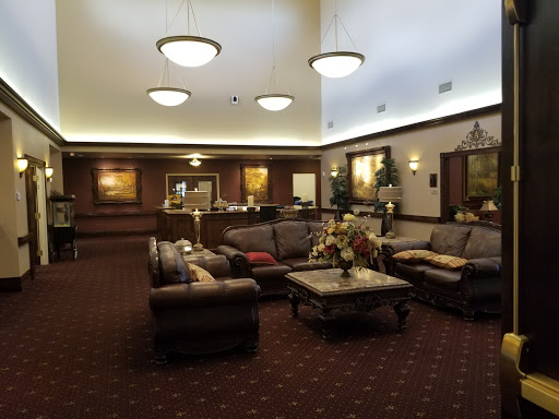 A cozy lobby area with comfortable seating and warm lighting, inviting relaxation and conversation.
