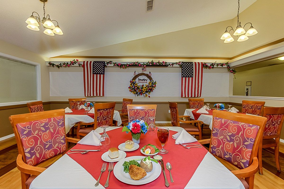 A festive dining area adorned with American flags and elegant table settings.
