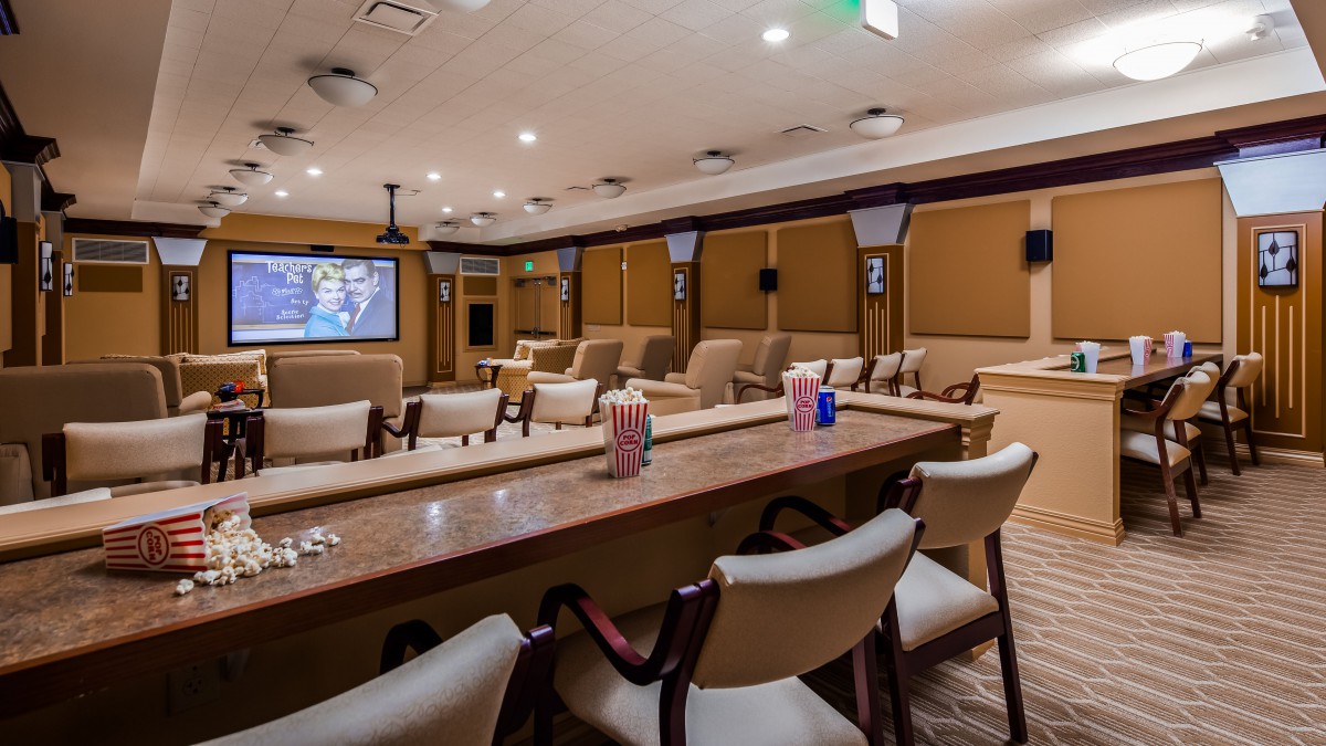 A comfortable lounge area with seating and a large television.