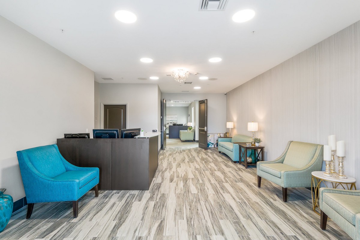 A modern waiting room with comfortable seating and elegant interior design.