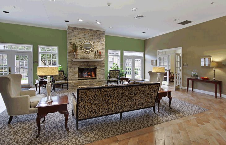 A cozy living room with a fireplace and stylish furniture.
