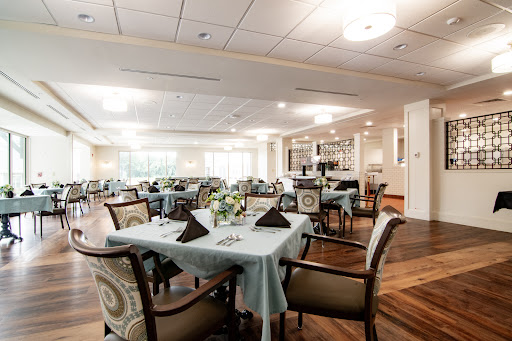 A beautifully arranged dining room with elegant tables and chairs, perfect for a cozy meal.