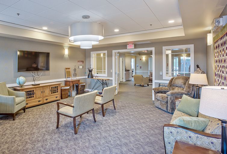 A spacious and well-lit lobby featuring comfortable seating and modern decor.