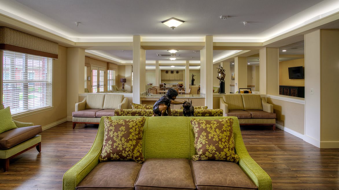 A spacious hotel lobby with elegant seating and decorative elements.