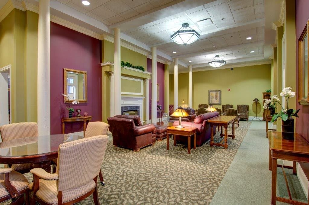 A cozy and elegant lounge area with comfortable seating and warm lighting.