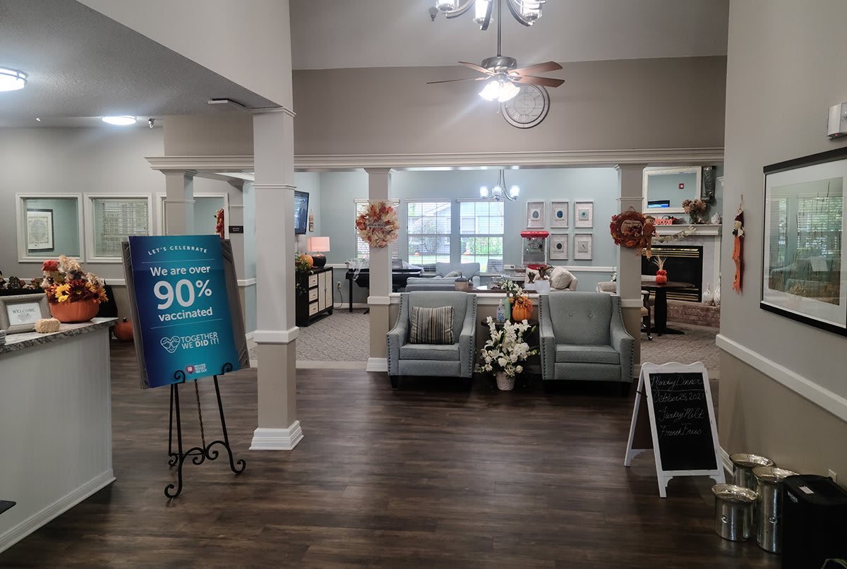 A cozy living room area featuring comfortable seating and elegant decor.