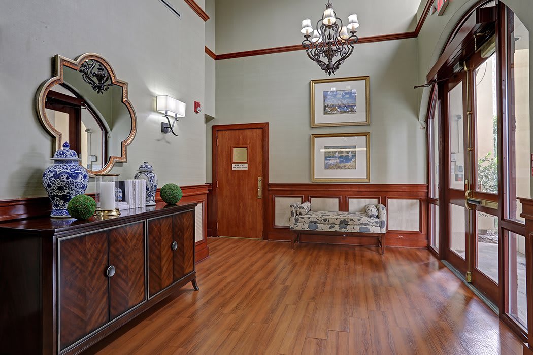 A well-appointed lobby with elegant decor and wood flooring.