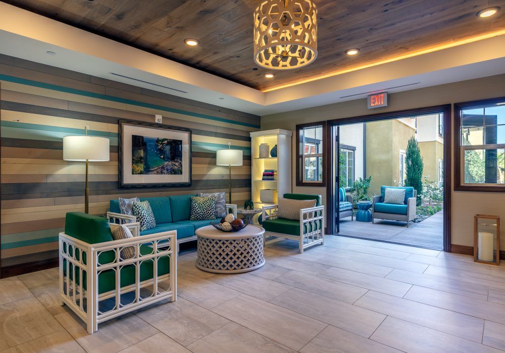 A modern lobby with stylish furniture and a cozy seating area.