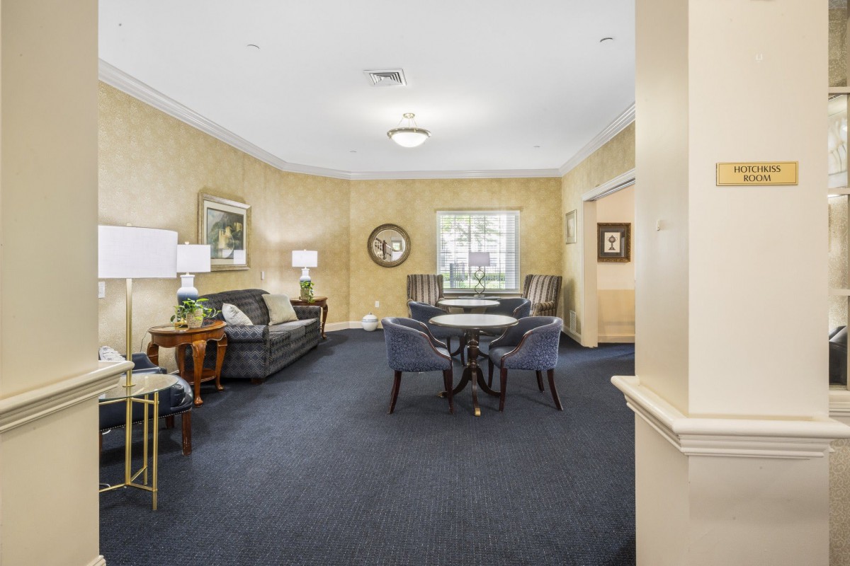 A well-decorated living room with elegant furniture and warm lighting.