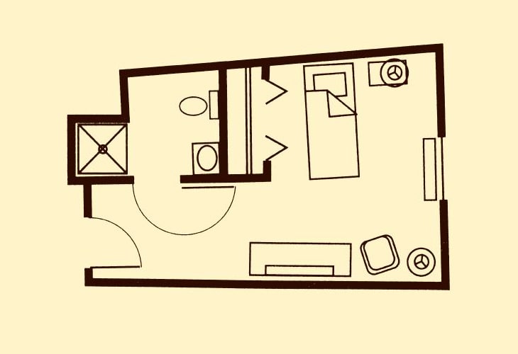 A simple floor plan of a small apartment featuring a bedroom, bathroom, and living area.