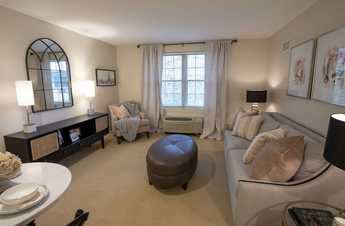 A cozy living room with soft lighting and comfortable furnishings.