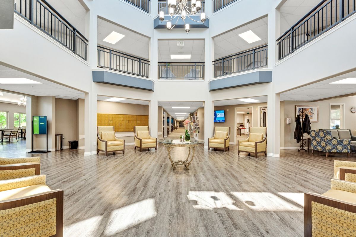 A spacious and modern atrium lobby with ample seating and natural lighting.