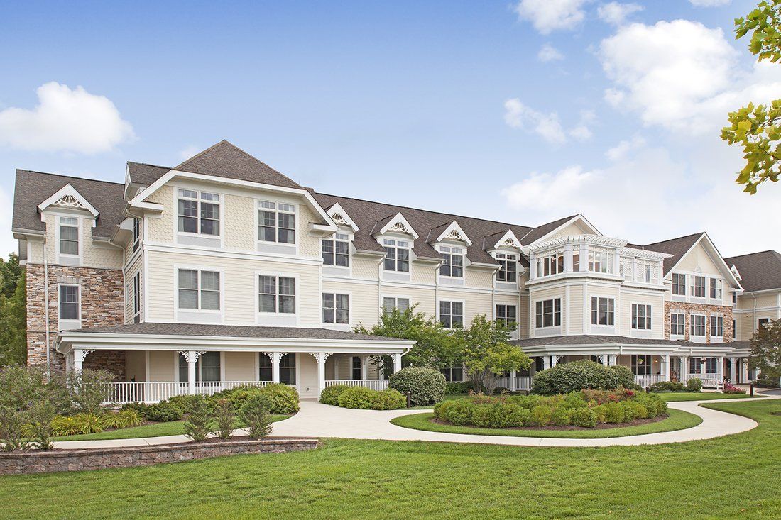 A modern residential building with well-maintained landscaping.