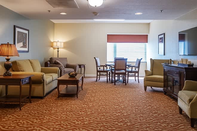 A cozy living room with comfortable seating and a dining area.
