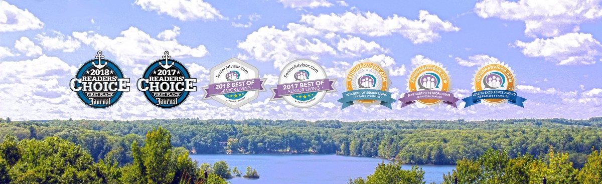 A scenic view of a lake with award badges displayed over the image.