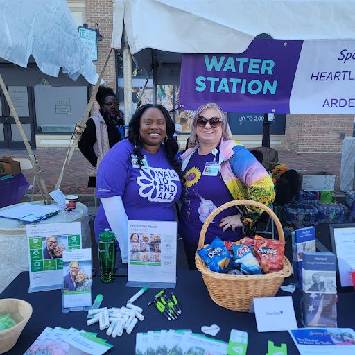 Volunteers at a community event, promoting health and wellness with a water station.