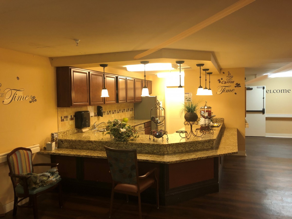A modern kitchen with a stylish countertop and warm lighting.