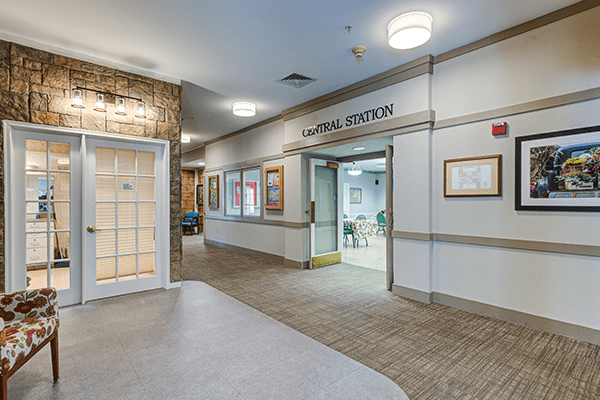 A hospital corridor leading to a physical therapy department.