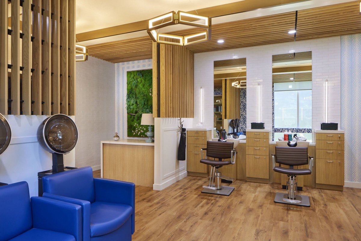 Modern salon interior with stylish furniture and lighting.