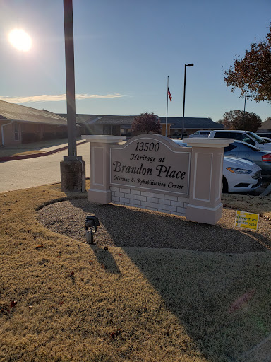 Entrance sign for a facility, capturing the sunny outdoor environment.